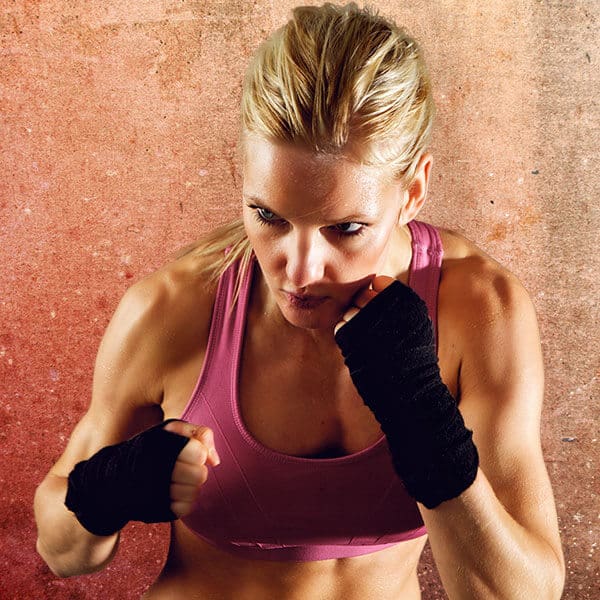 Mixed Martial Arts Lessons for Adults in Mission Viejo CA - Lady Kickboxing Focused Background