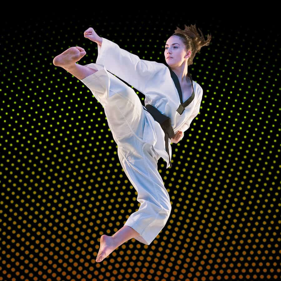 Martial Arts Lessons for Adults in Mission Viejo CA - Girl Black Belt Jumping High Kick