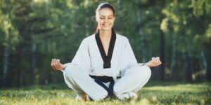 Martial Arts Lessons for Adults in Mission Viejo CA - Happy Woman Meditated Sitting Background